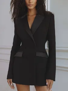 Detailed view of elegant black double-breasted blazer dress with satin lapels