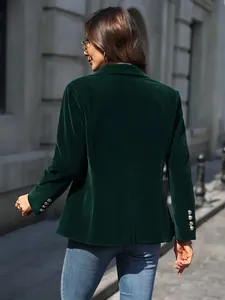 Back view of a premium dark green velvet blazer featuring stylish metallic sleeve buttons
