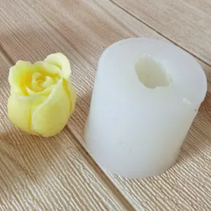 Detailed view of a tulip flower silicone mold with finished yellow wax candle flower