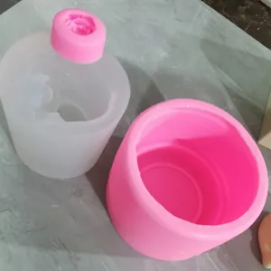 Close-up view of pink and translucent silicone molds for rose-shaped crafts and decor