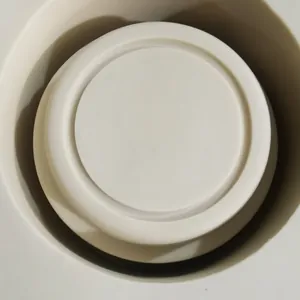 Top-down macro view of white tiered silicone mold base for music boxes and chocolates