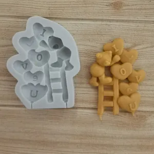 Detail of heart-shaped balloon and bear silicone mold for Valentine's Day baking.