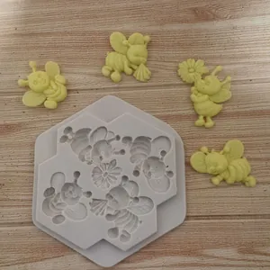 Detailansicht der Silikonform für fliegende Zeichentrickbienen mit Fondant-Bienen