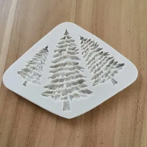 Close-up of a white 3-cavity Christmas tree silicone mold for cake and fondant DIY