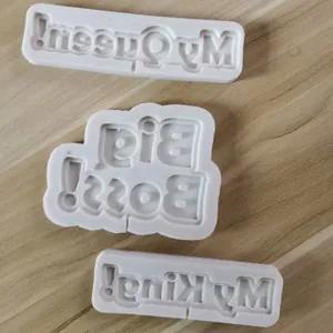 Detailed view of silicone molds featuring My King, My Queen, and Big Boss lettering