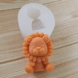 Detailed view of cute cartoon lion silicone mold and finished orange mousse cake