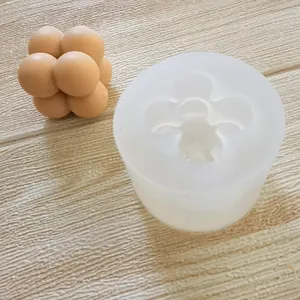 Detailed view of professional 8-ball bubble cluster silicone mold with yellow wax sample