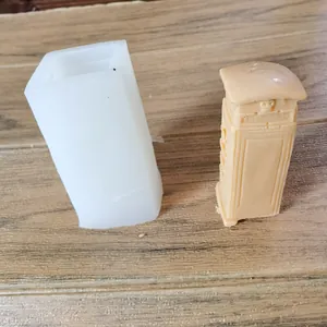 Detailed view of a silicone candle mold and a telephone booth shape wax finished product