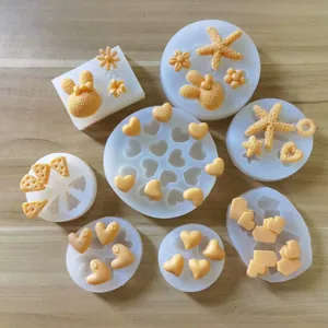 Detailed view of silicone molds showing heart, cheese, and starfish shapes with samples