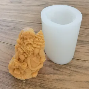Close-up view of Santa Claus silicone candle mold and the finished gypsum figure