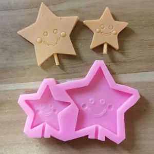 Detail showing 2-cavity star smiley face silicone mold and finished fondant stars