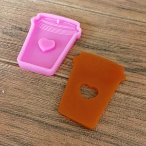 Detail of milk tea cup silicone mold with heart design for DIY resin crafts.