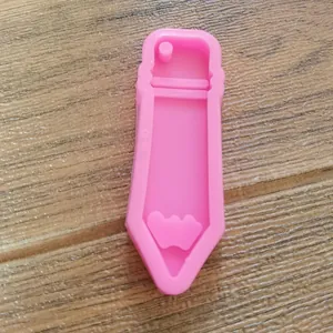 Detailed view of pink pencil-shaped silicone mold for resin crafts and keychains