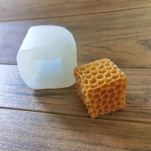 Detail view of cube honeycomb silicone mold showing the finished textured candle