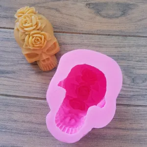 Macro view of pink silicone skull mold with intricate rose details for DIY crafts