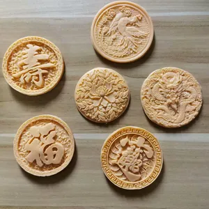 Detailed view of Chinese-style carved fondant pieces with dragon and longevity motifs