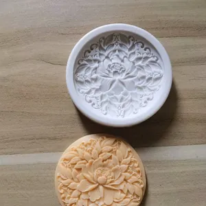 Macro detail of an intricate peony flower silicone mold with finished floral product