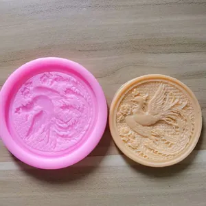 Detail view showing circular silicone mold with traditional Chinese phoenix relief and sample.