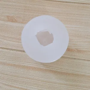 Top view of a white silicone mold for knot-shaped candles and gypsum crafts.