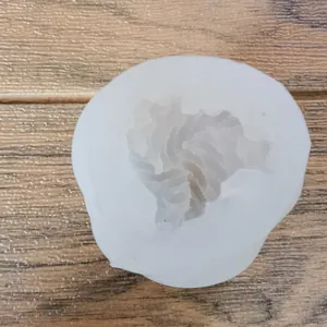 Detailed macro view of a yarn ball shaped silicone mold for DIY crafts