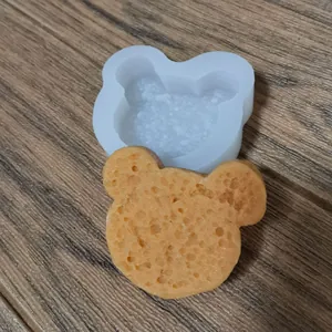 Detail showing bear-shaped silicone mold and textured sponge cake finished product