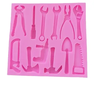 Pink silicone mold featuring hardware tools shapes for cake fondant decoration