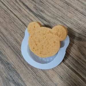 Detailed view of mouse shaped silicone mold with a textured sponge cake craft insert