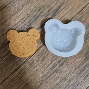 Close-up of a bear-shaped silicone mold with a realistic sponge cake finish tool