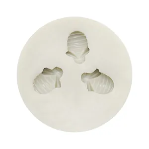Detailed view of white silicone mold featuring three bee-shaped cavities