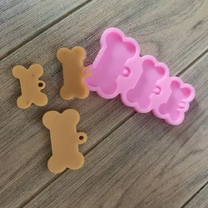 Dettaglio dello stampo in silicone a 3 cavità a forma di osso per ciondoli in resina