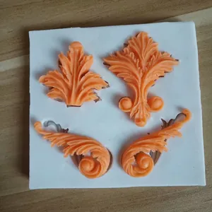 Detailed view of European style relief silicone mold with orange fondant decoration.
