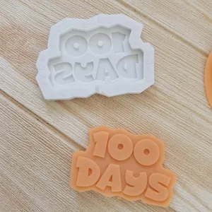Detailed macro view of 100 DAYS silicone mold for chocolate and fondant cake toppers