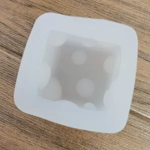 Macro view of a square dice silicone mold for plaster and chocolate DIY