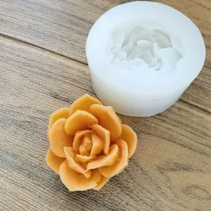 White silicone succulent flower mold showing a finished orange wax flower detail