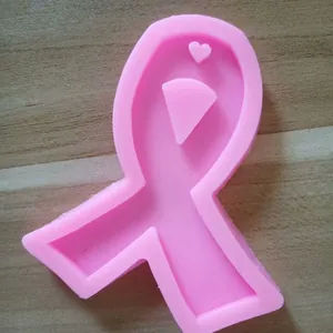 Close-up detail of a pink awareness ribbon silicone mold with a tiny heart shape