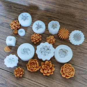 Detail view of various succulent and flower shaped silicone molds with finished crafts