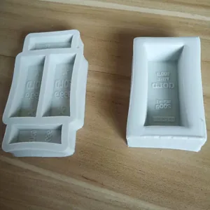 Detailed close-up of gold bar shaped silicone molds for chocolate and cake decorating
