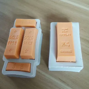 Close-up detail of flexible silicone molds featuring a realistic gold bar design.