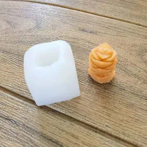 Close-up view of white silicone mold with rose succulent shaped finished craft product