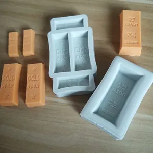Detailed view of gold bar silicone molds with finished chocolate bar samples