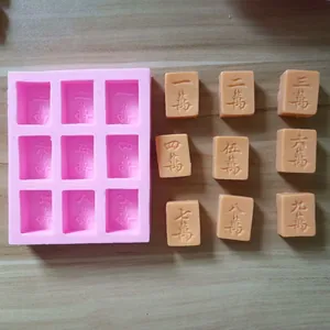 Detailed view of Mahjong character silicone mold for chocolate with finished pieces