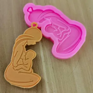 Silicone mold for mother and child keychain showing the mold and finished resin piece.