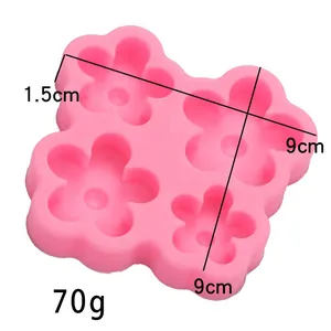 Vue détaillée du moule en silicone fleur à 4 cavités rose avec dimensions et poids.