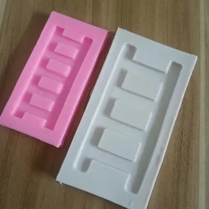 Detailed view of two ladder-shaped silicone molds for fondant and cake decorating