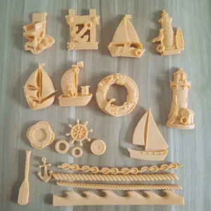 Nautical themed cake decoration molds featuring anchors, sailboats, and lighthouses