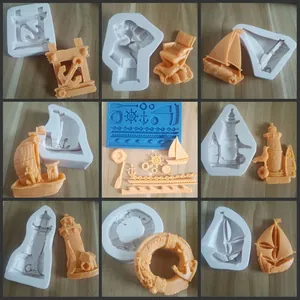Detailed view of 9 nautical silicone molds and fondant casts for cake decoration