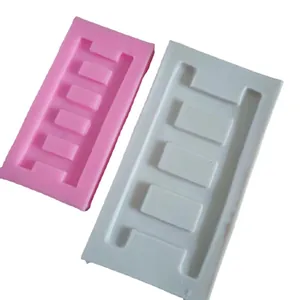 Set of pink and white ladder shaped silicone molds for fondant and cake decorating