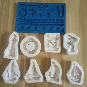 Variety of nautical themed silicone molds featuring ships, anchors, and lighthouses for cakes