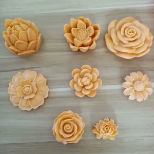 Detail view of eight different flower-shaped silicone molds for plaster and baking