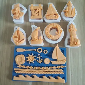 Silicone molds for nautical cake decor, including ships, anchors, and lighthouses.